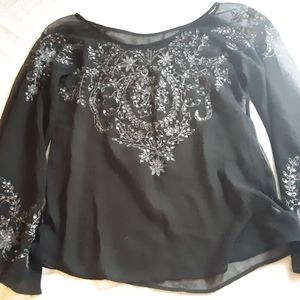 Black bead and sequined top.